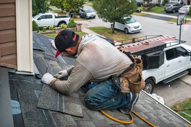 Professional Roofing technician working in West Point, IL